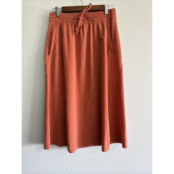 Athleta Jupe Arrival Midi Skirt Size 8 Drawstring Travel Orange pockets - Picture 1 of 4
